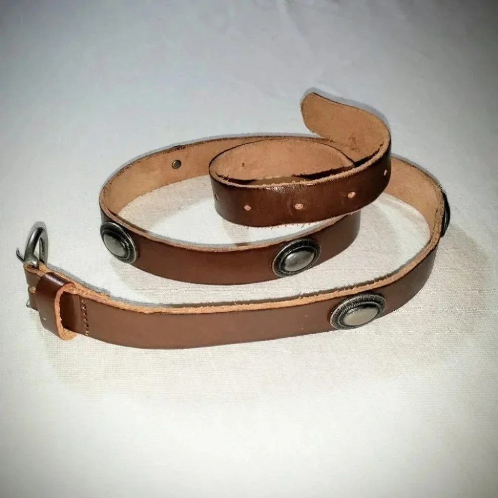Brown leather western belt with silver accents